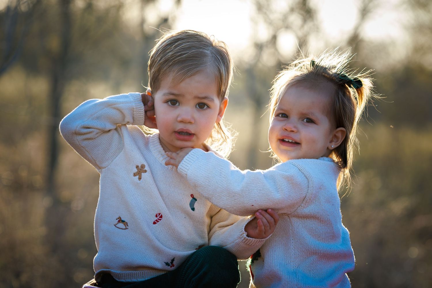 A collection of candid family photos taken outdoors during golden hour with sunlight filtering through trees.