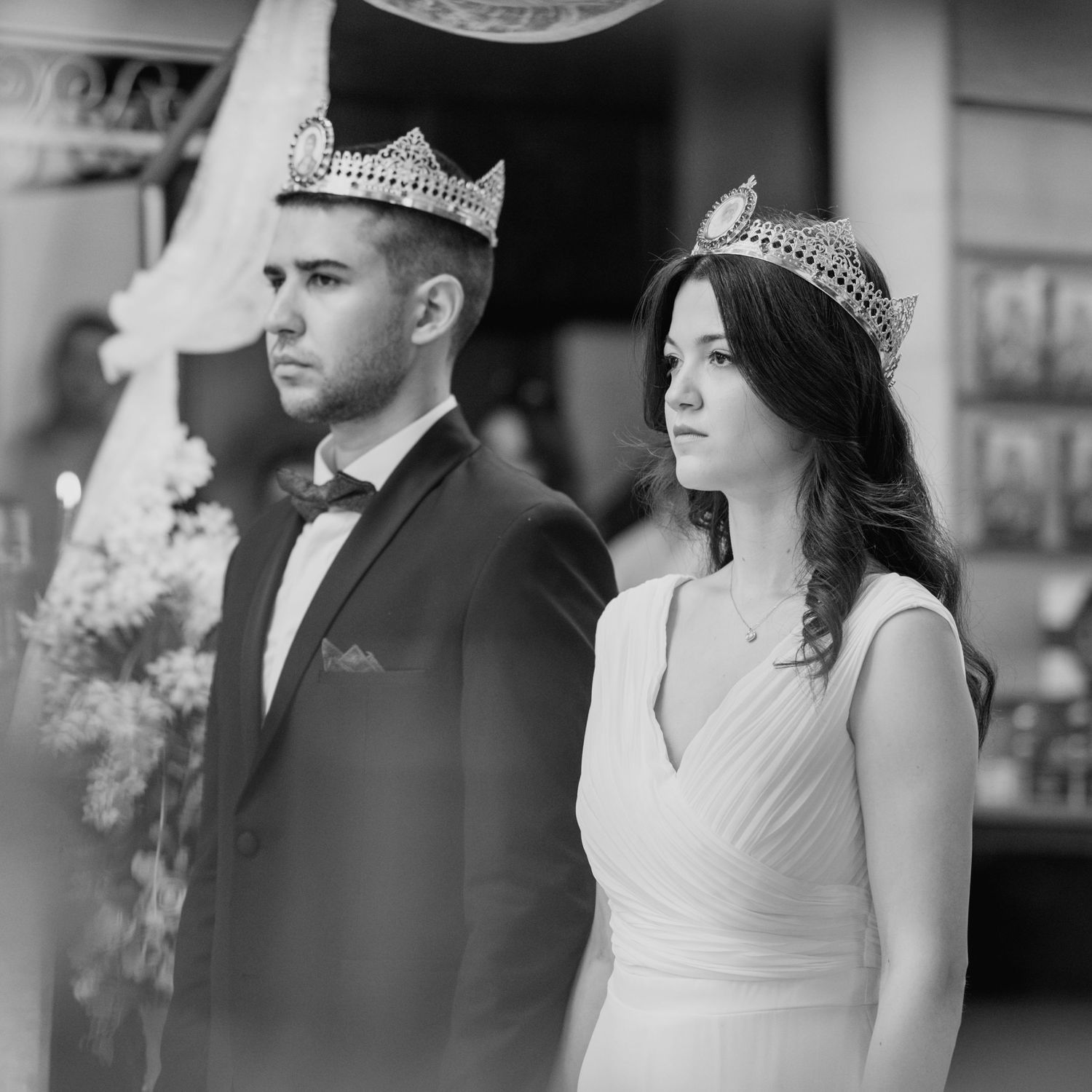 Black and white wedding portrait showing formal attire and celebratory moments.
