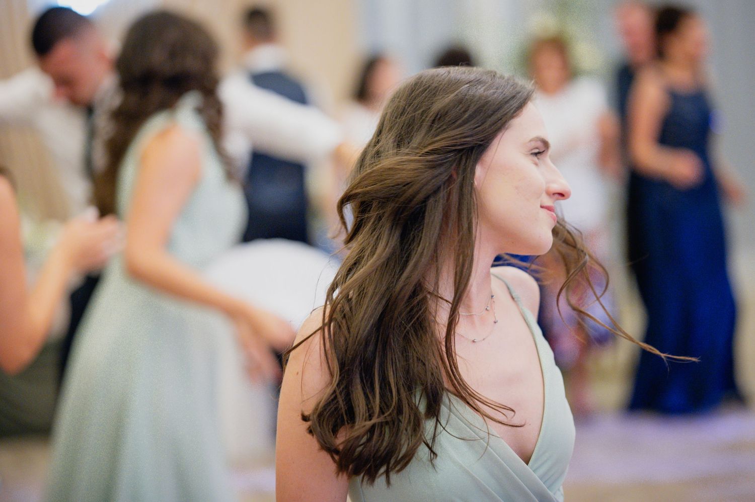 Wedding reception guests enjoying lively dance floor moments.