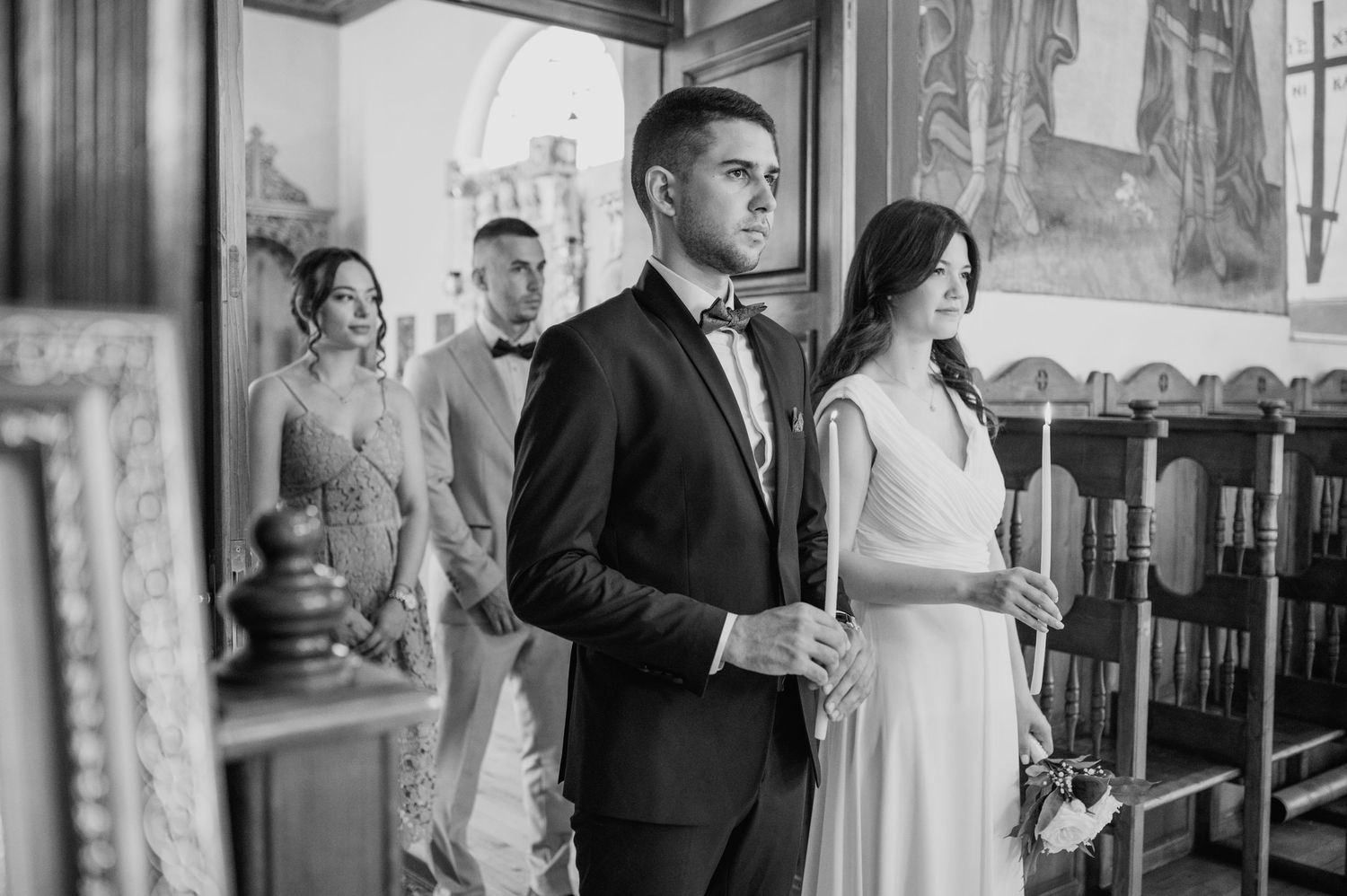 Elegant wedding ceremony interior with vintage decor and architectural details.