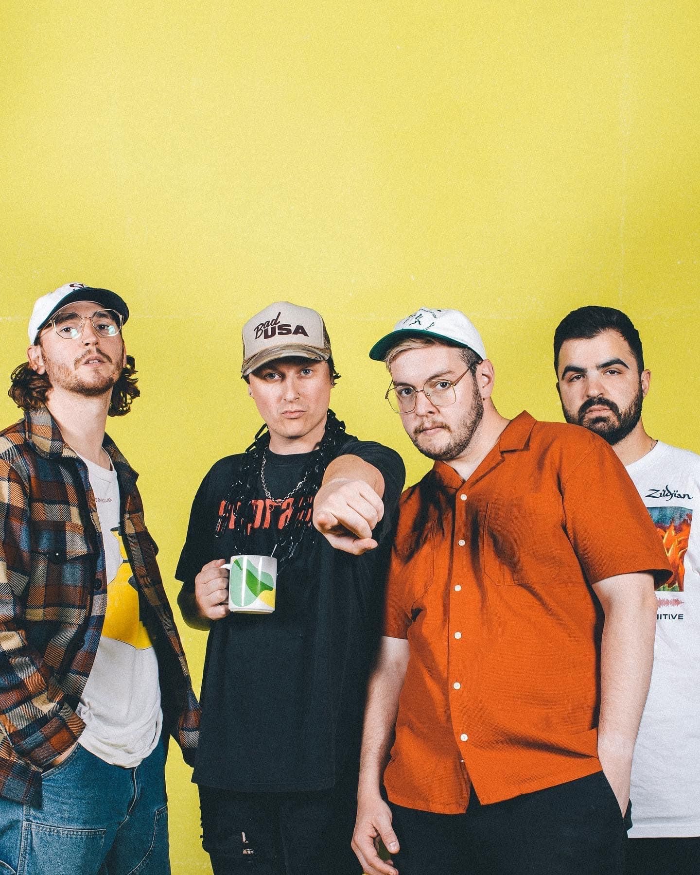 State Champs posing together against yellow backdrop with casual attire.