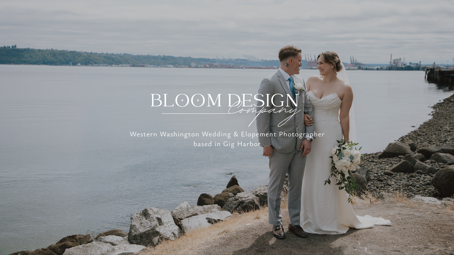Bloom Design Co wedding couple posing on rocky shoreline with waterfront views in Western Washington.