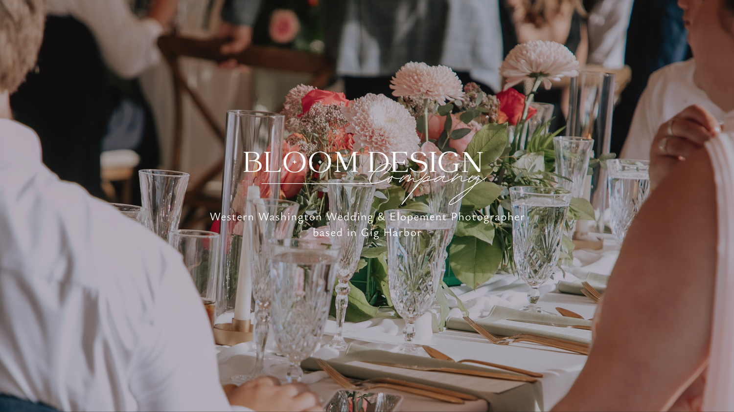 Bloom Design Co elegant wedding reception tablescape with pink floral centerpieces and crystal glassware.