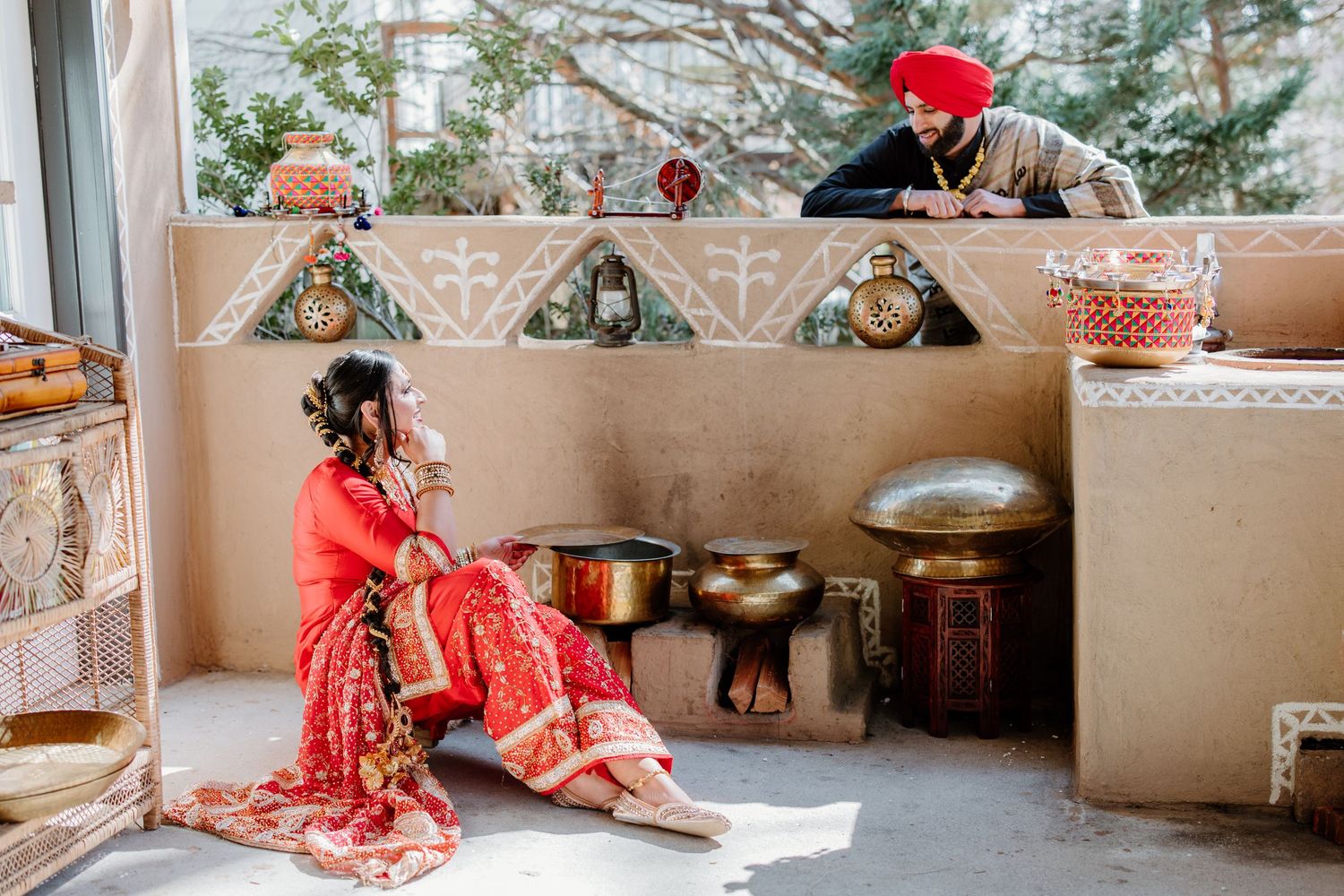 Traditional Indian couple performing wedding rituals at a decorative mandap during an intimate ceremony.