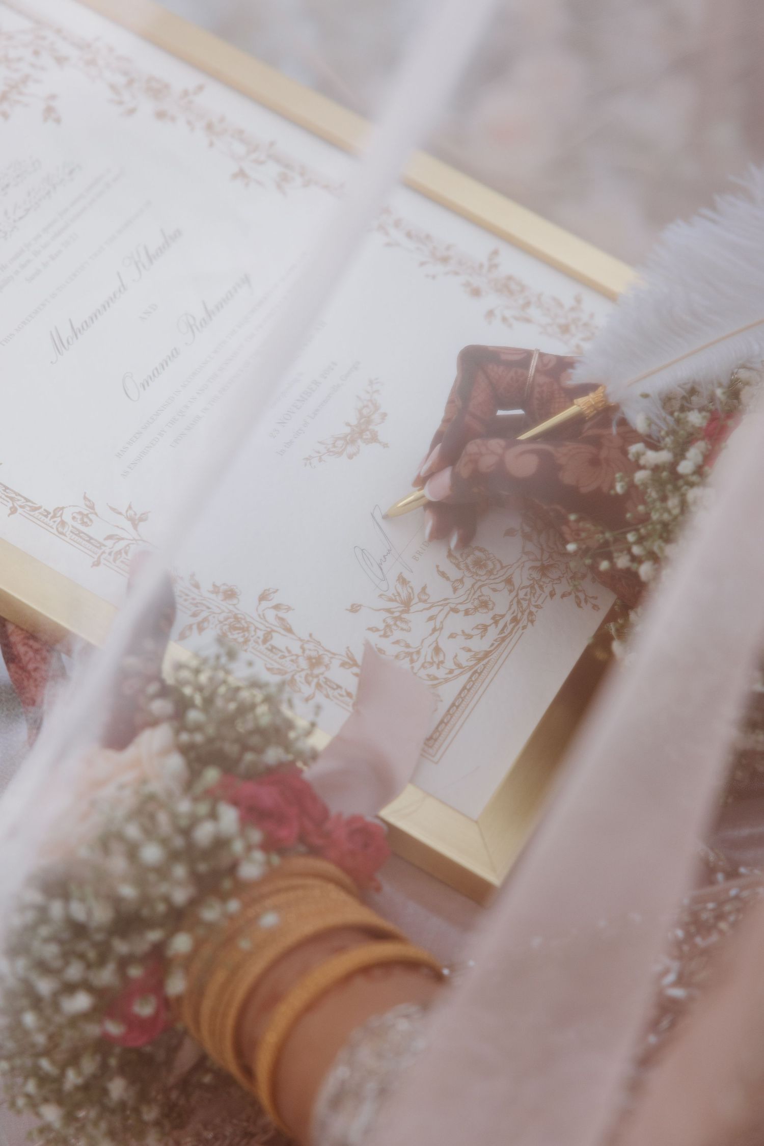 A soft-focus wedding register or guest book with delicate floral decorations and baby's breath flowers.