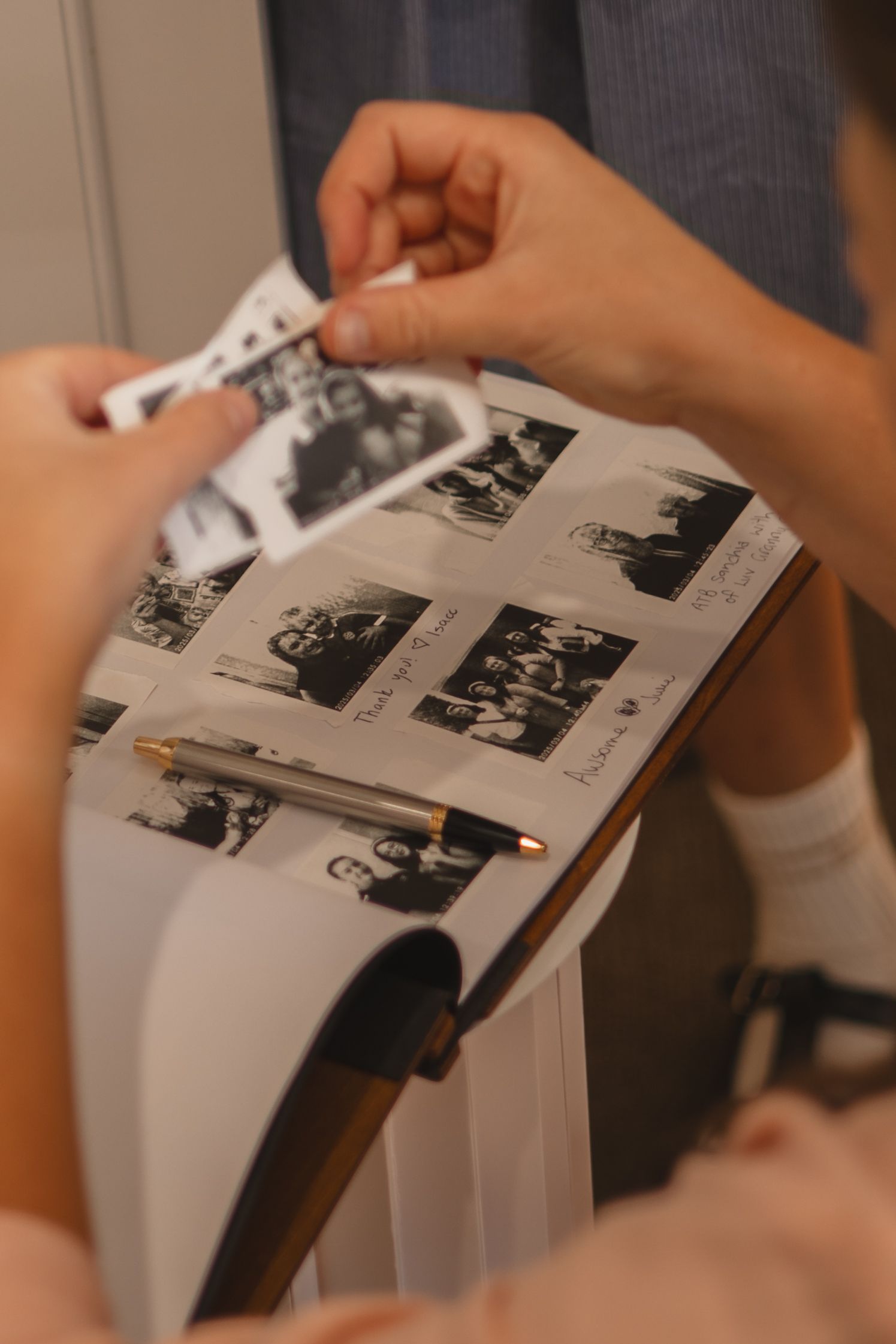 Pages from a black and white photo album or scrapbook being flipped through in sequence.