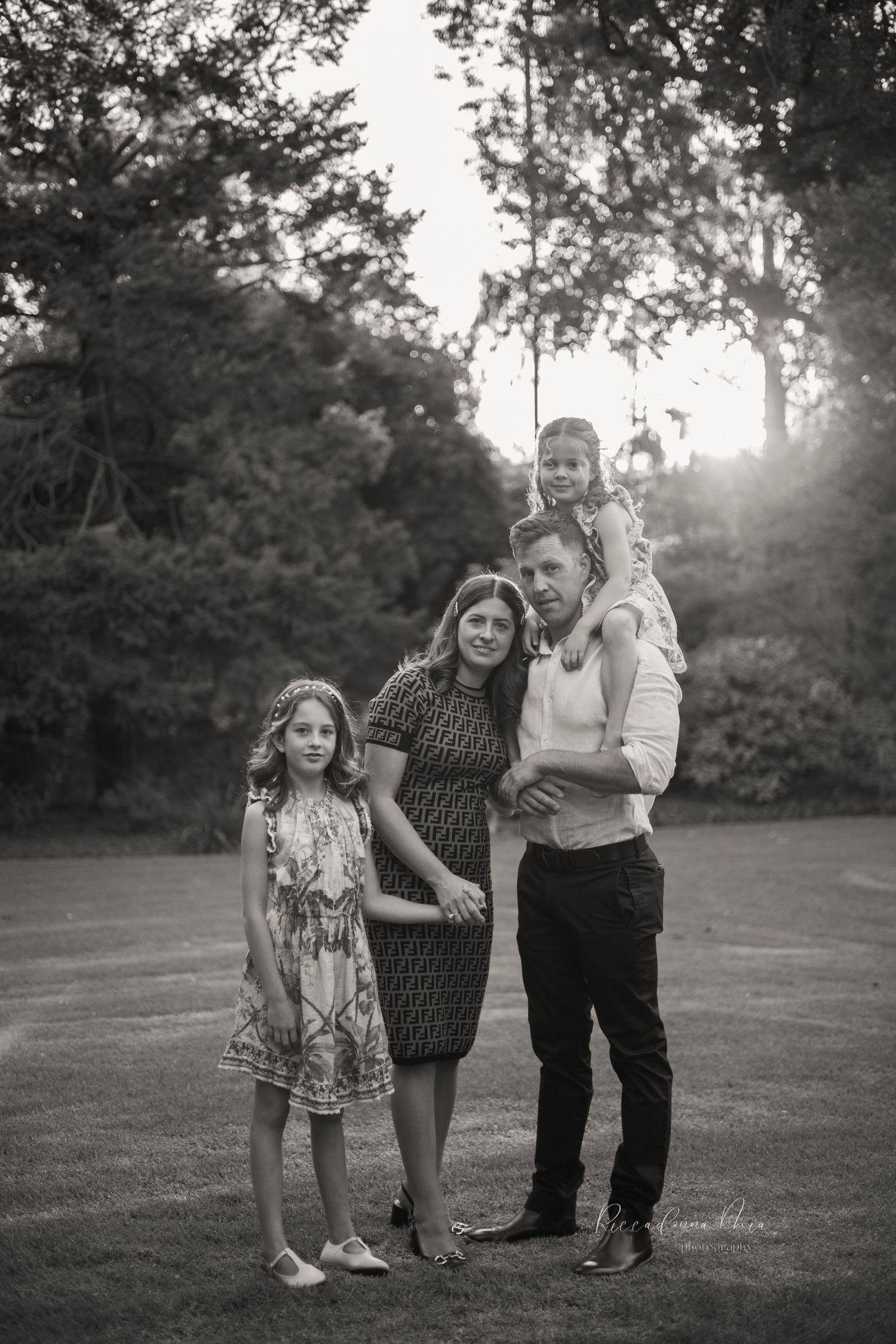 Black and white candid family portrait.