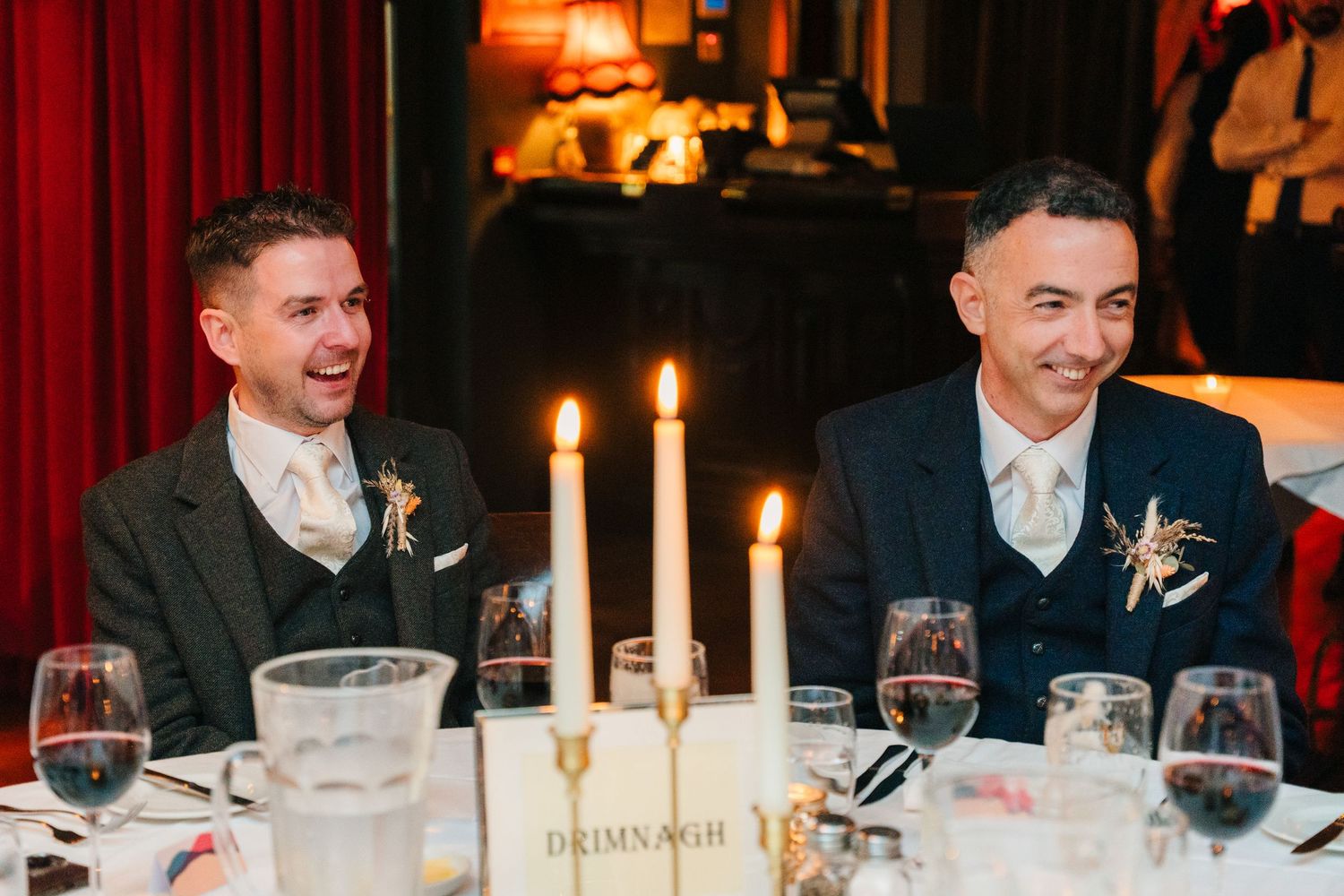 Candlelit dinner reception with wine glasses and formal place settings. Marco Pierre Dublin Wedding Photographer