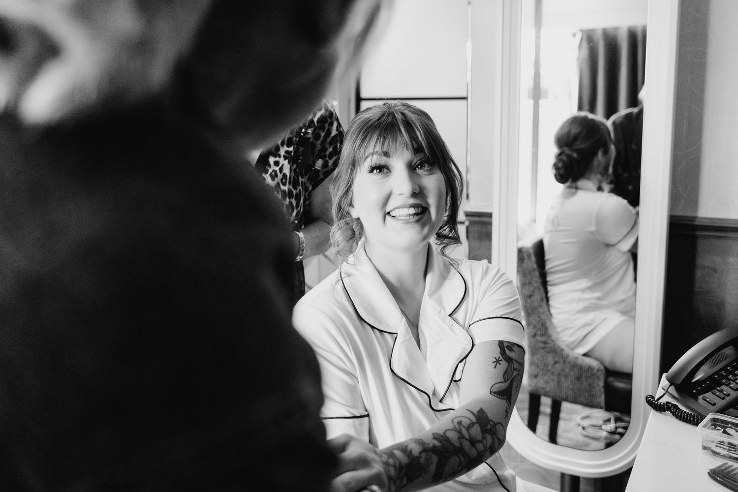 Behind the scenes getting ready moment captured in black and white with a mirror reflection. PHOTOGRAPHER Dublin Ireland Wedding