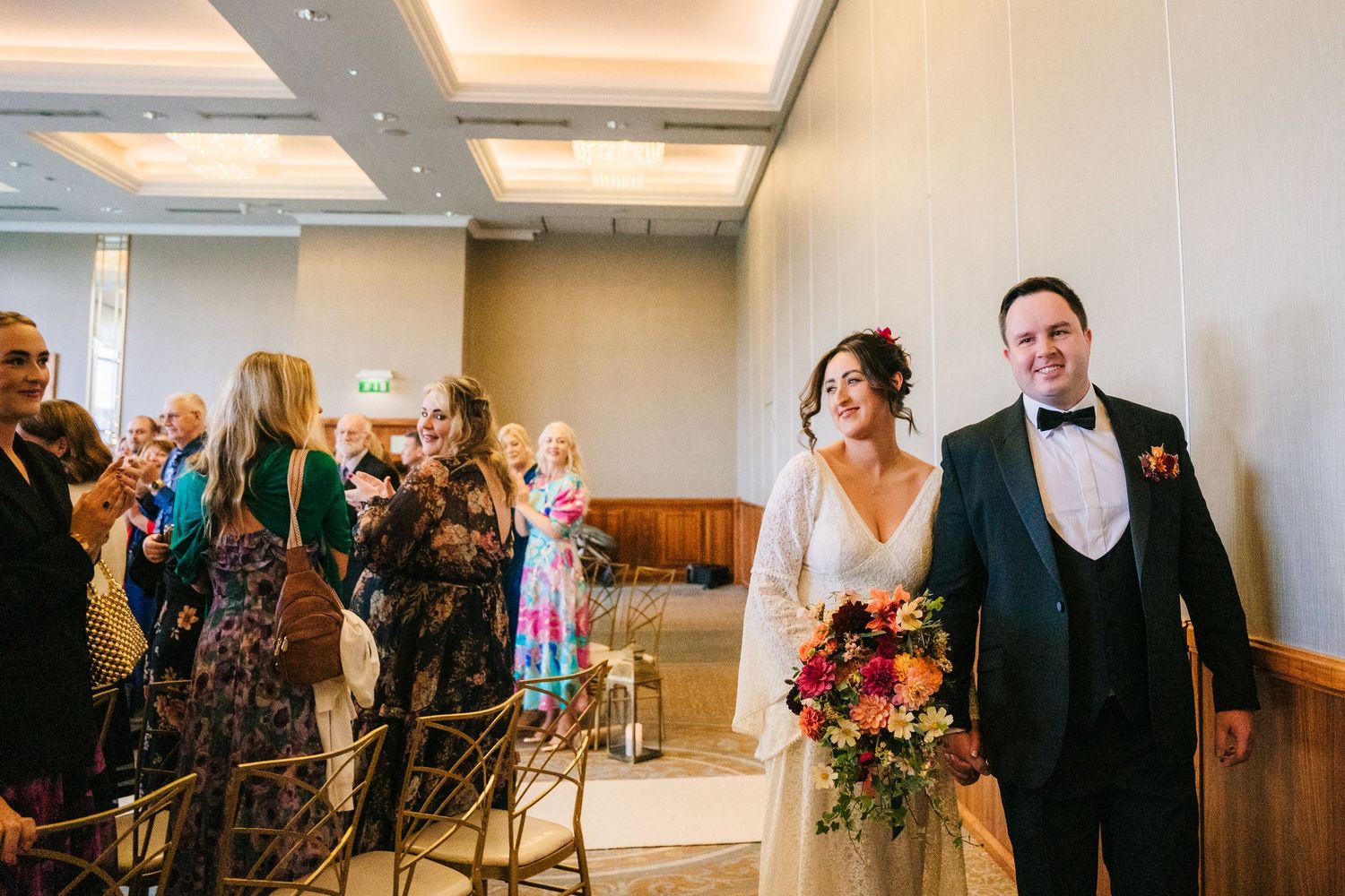 Modern wedding venue interior with warm lighting and elegant ceiling details. Wedding Photography Trim Castle Ireland