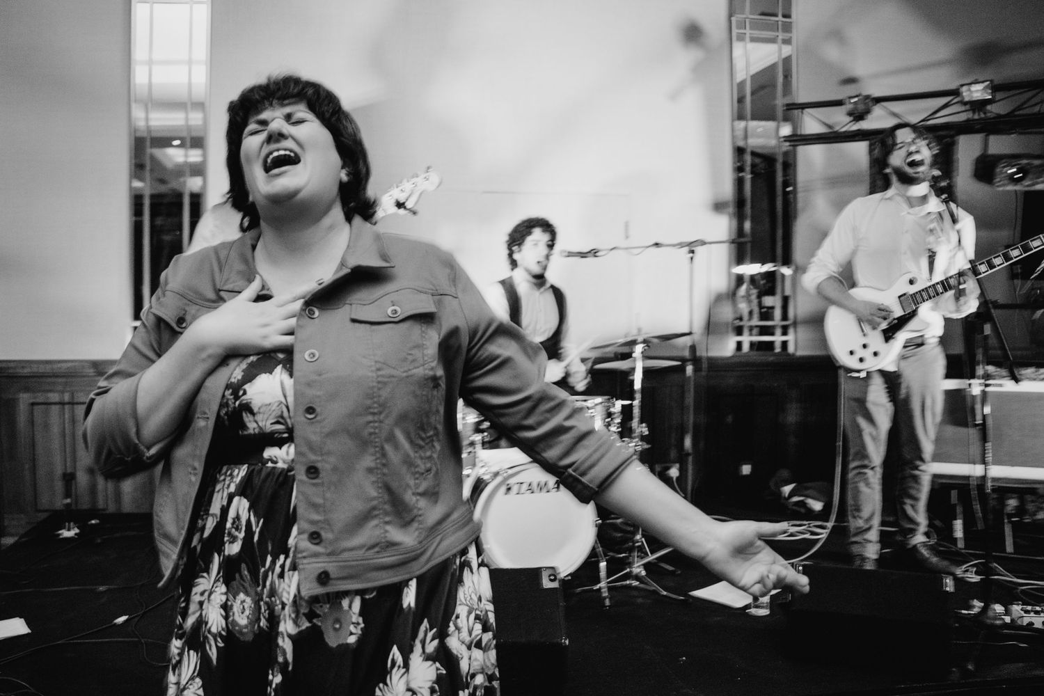 Black and white photo of musicians performing on stage during a band rehearsal or practice session.Wedding Photography Trim Castle Ireland