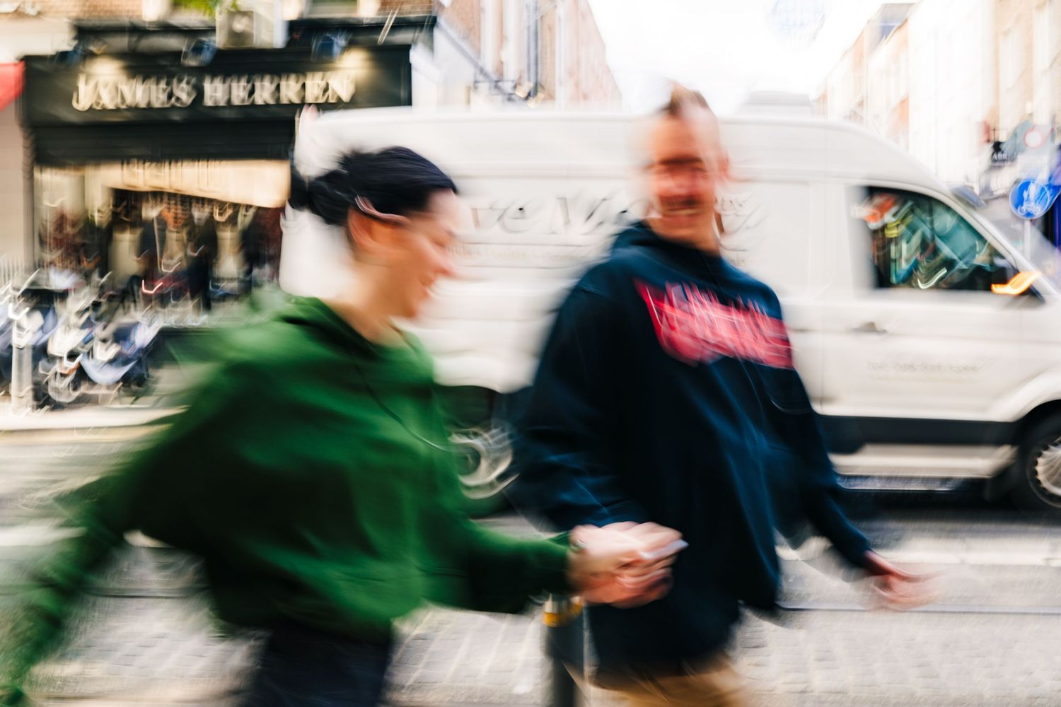 Motion-blurred street photography capturing movement against urban backdrop. PHOTOGRAPHER Dublin Ireland