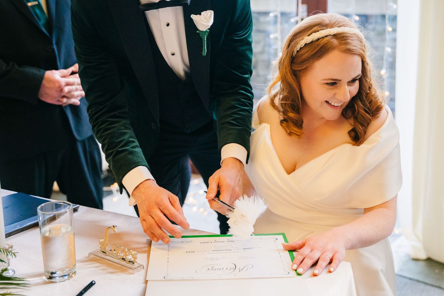 Close-up of signing documents during a wedding ceremony.  Wedding PHOTOGRAPHER Trim Castle