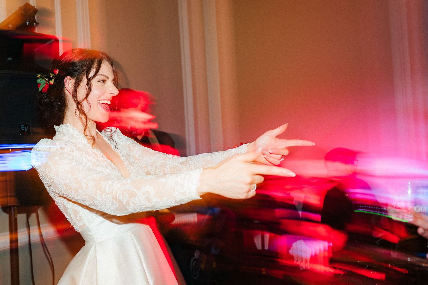 Wedding reception dance floor illuminated with red lighting as couple dances. Stephens green club dublin Wedding photographer