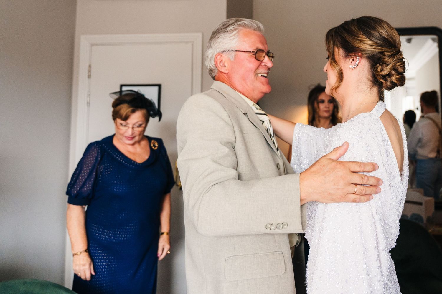 Emotional moment captured during what appears to be a wedding preparation with family members. House Dublin Wedding Photographer