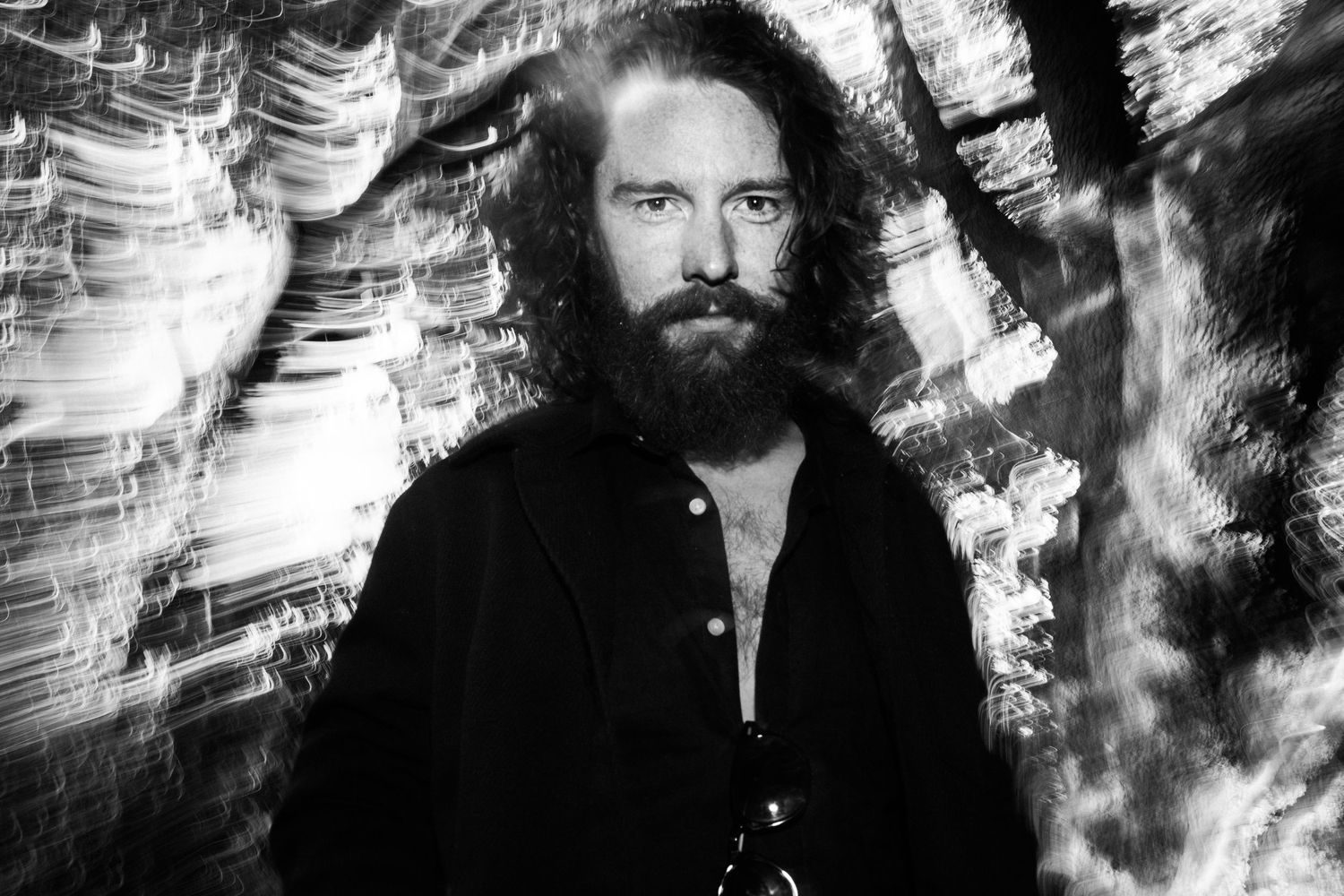 Grainy black and white portrait sequence with abstract light patterns creating a dramatic visual effect. PHOTOGRAPHER Dublin