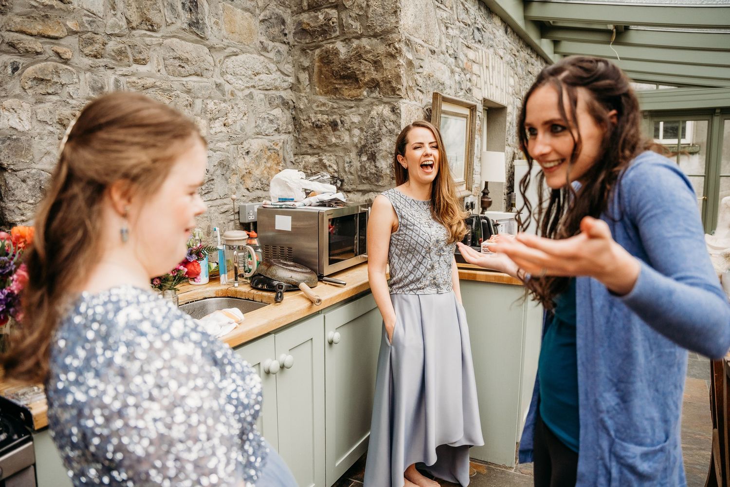 A series of candid moments showing laughter and joy between two people in a kitchen setting. Wedding photographer Dublin