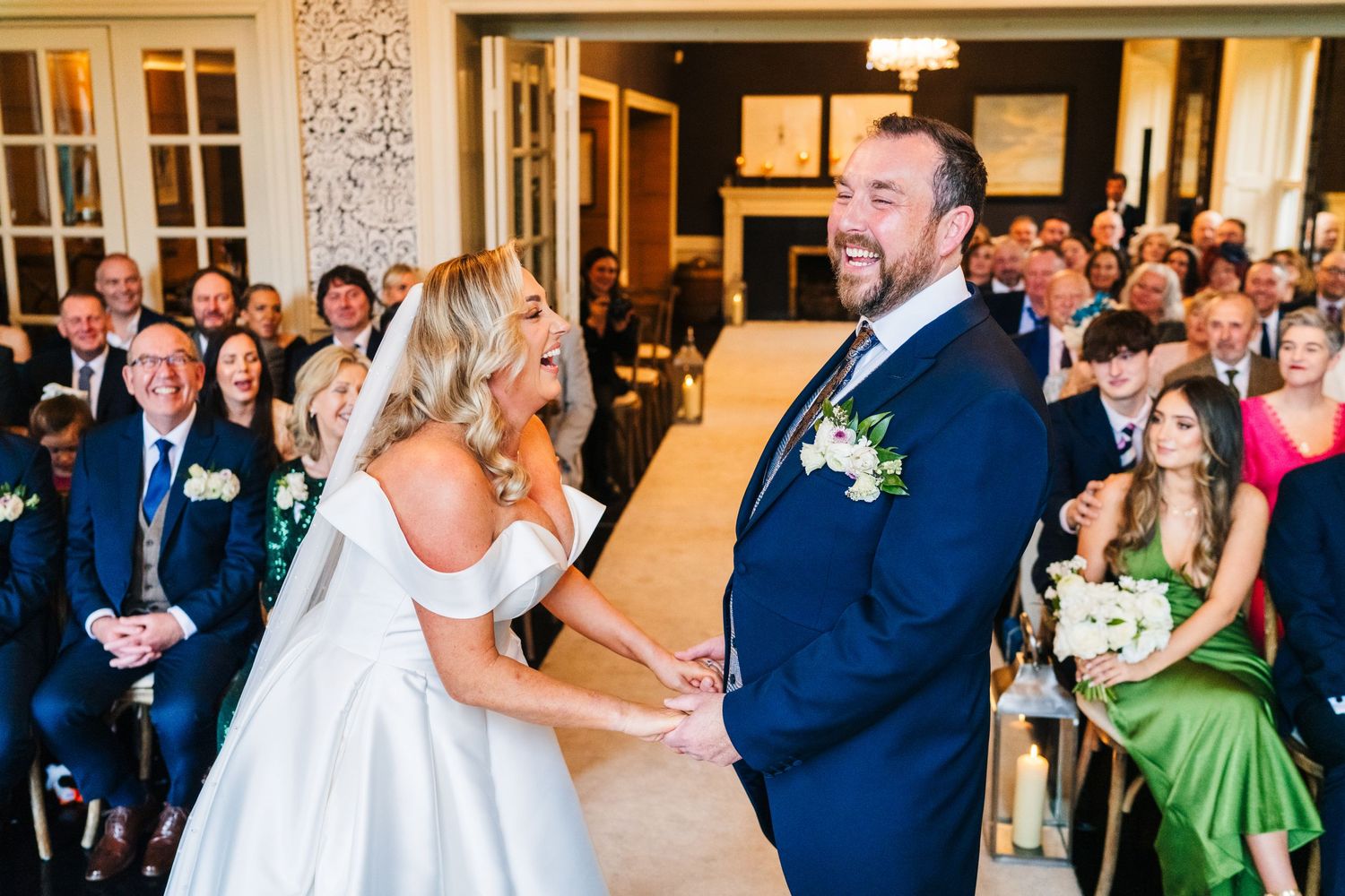Wedding celebration in an elegant ballroom with guests watching the newlyweds' first dance.  Virginia Park Lodge Wedding Photographer Cavan