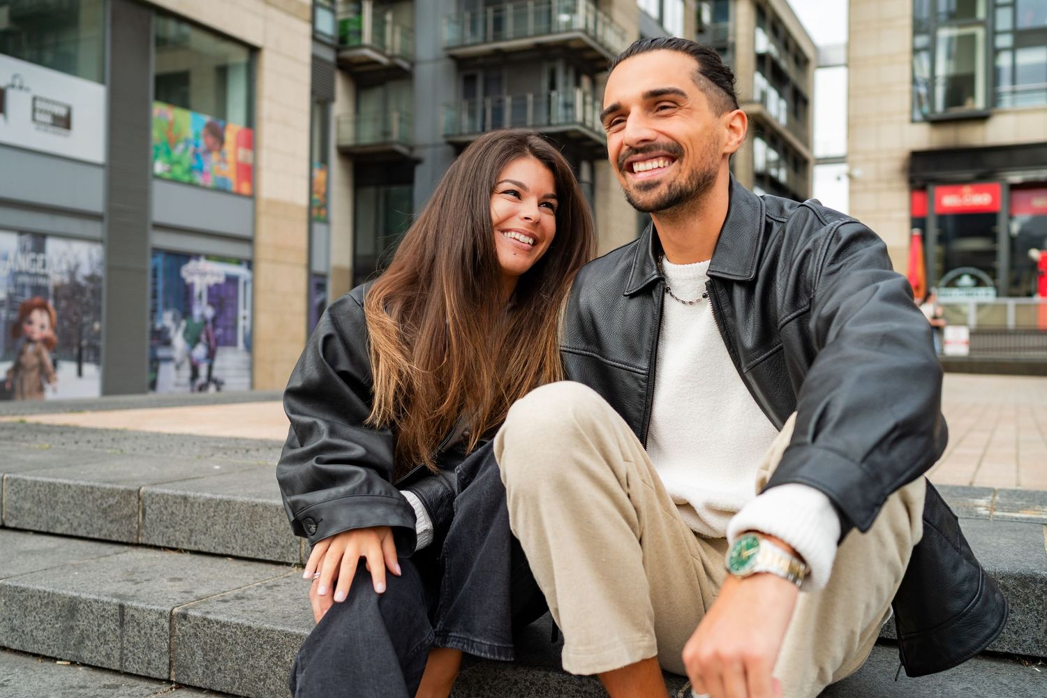 Happy couple shares laughter and coffee while walking together on a city street. Couple's Photoshoot PHOTOGRAPHER Dublin