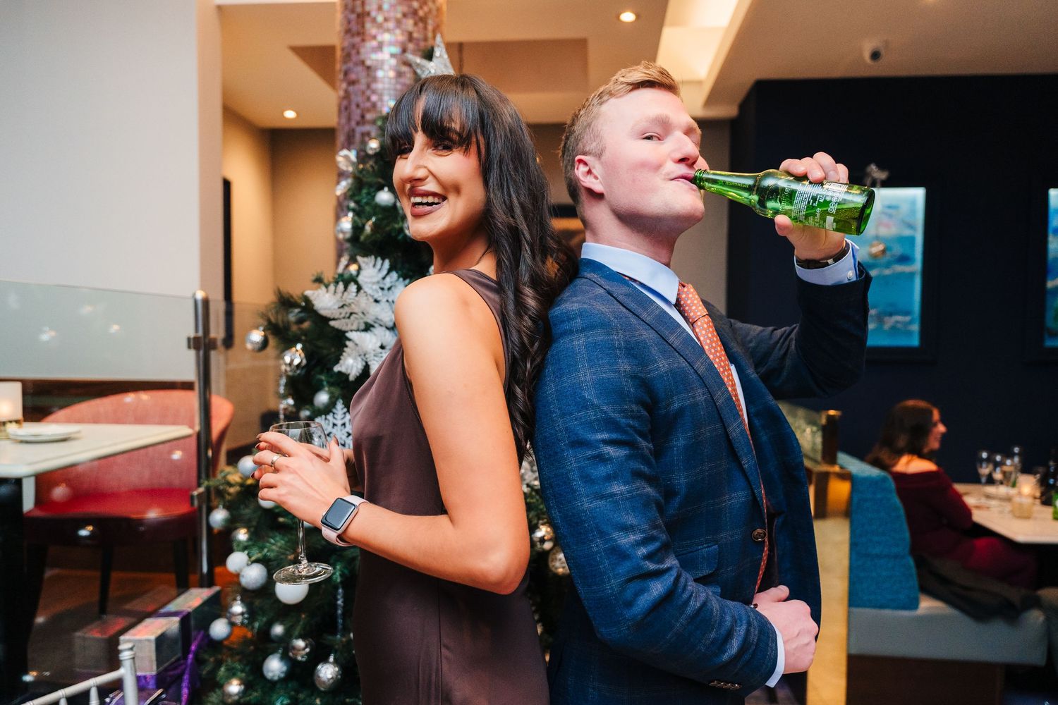 Wedding guests pose back to back at reception party with drinks and decorations. City Hall Dublin Photographer