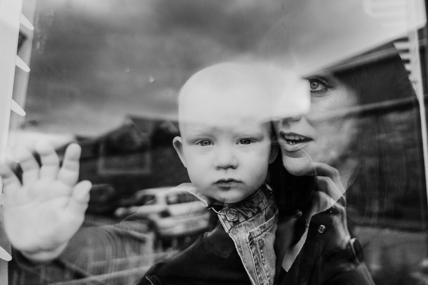 A vintage black and white photo montage showing several close-up portraits in contrasting light and shadow.  Family PHOTOGRAPHER Dublin