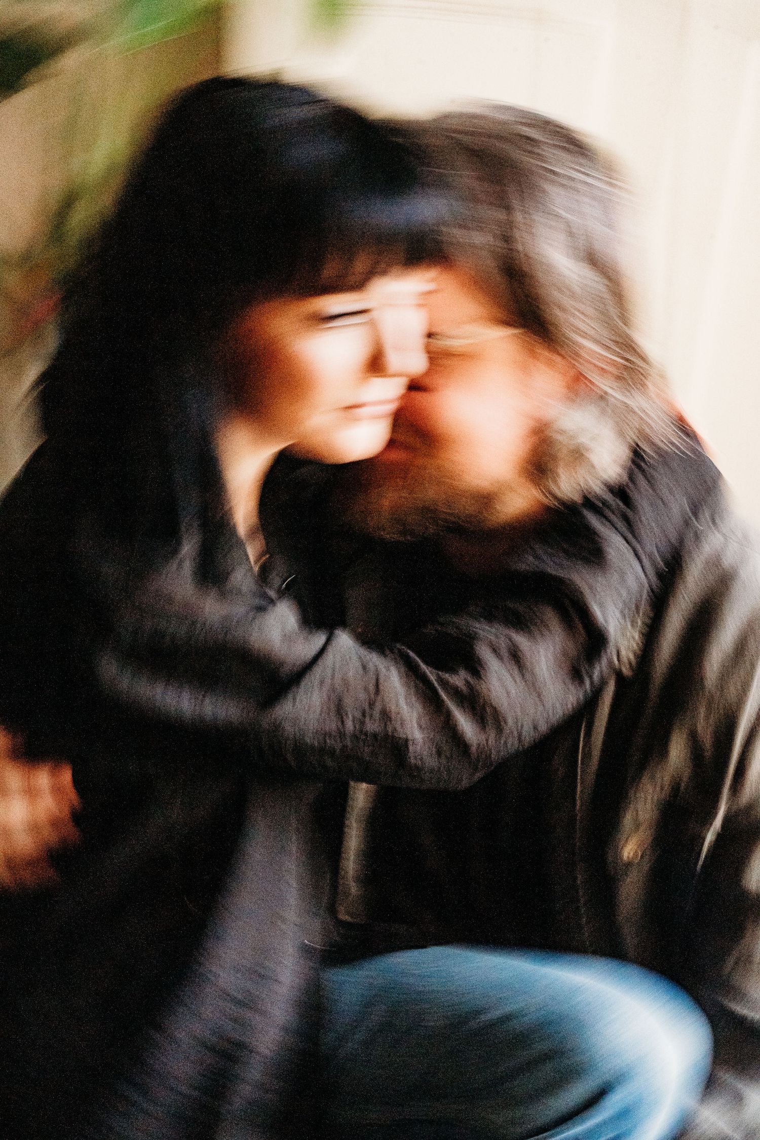 Artistic motion blur photograph of a person in a black jacket with blurred movement against a soft background. PHOTOGRAPHER Dublin ireland