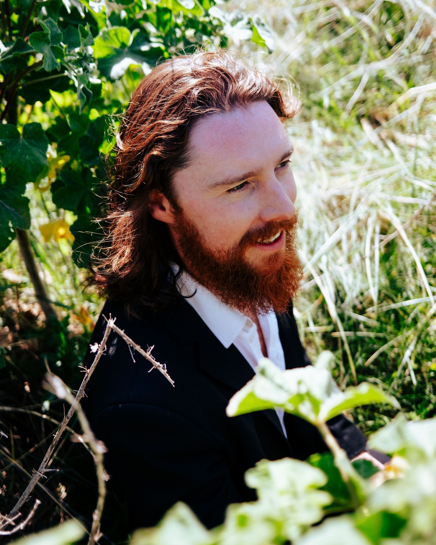 Artistic portrait series taken in natural sunlight through green foliage creating a dreamy outdoor effect. PHOTOGRAPHER Dublin ireland
