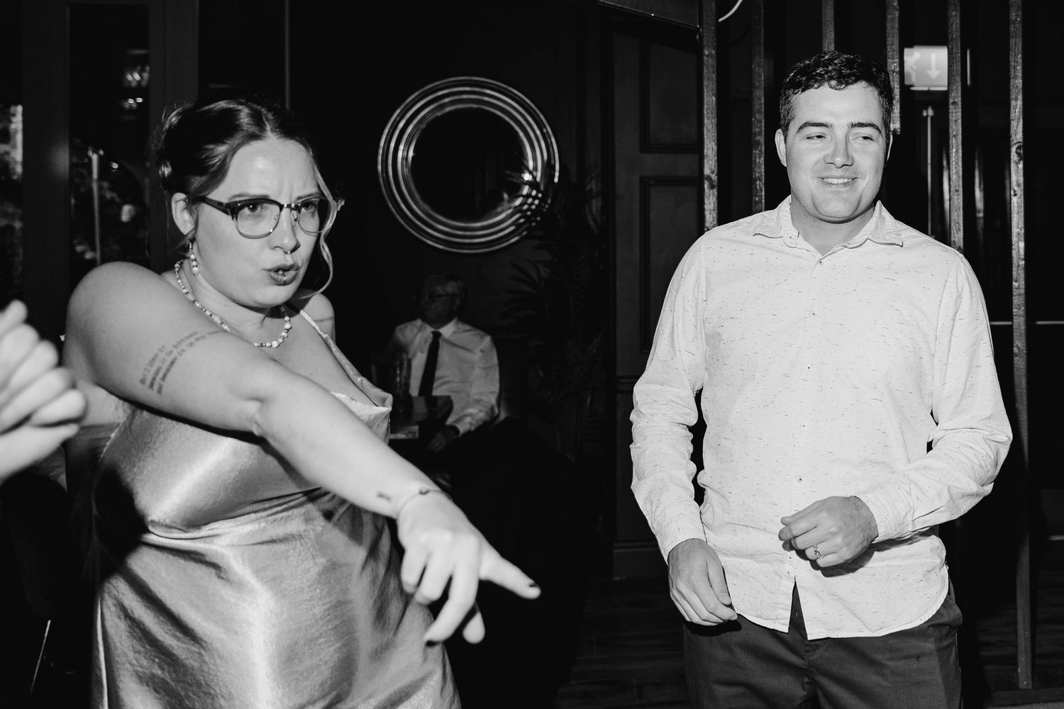 Poulaphouca Wedding photographer wicklow  A vintage black and white photo of two people dancing at a social gathering.