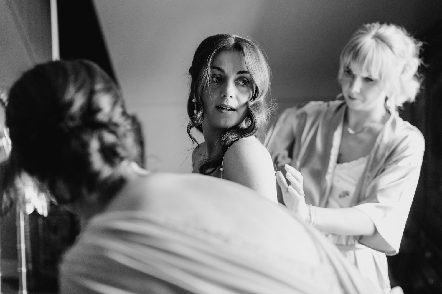 Castle Leslie Wedding Photographer Dublin Black and white photo of wedding preparations with soft window lighting.