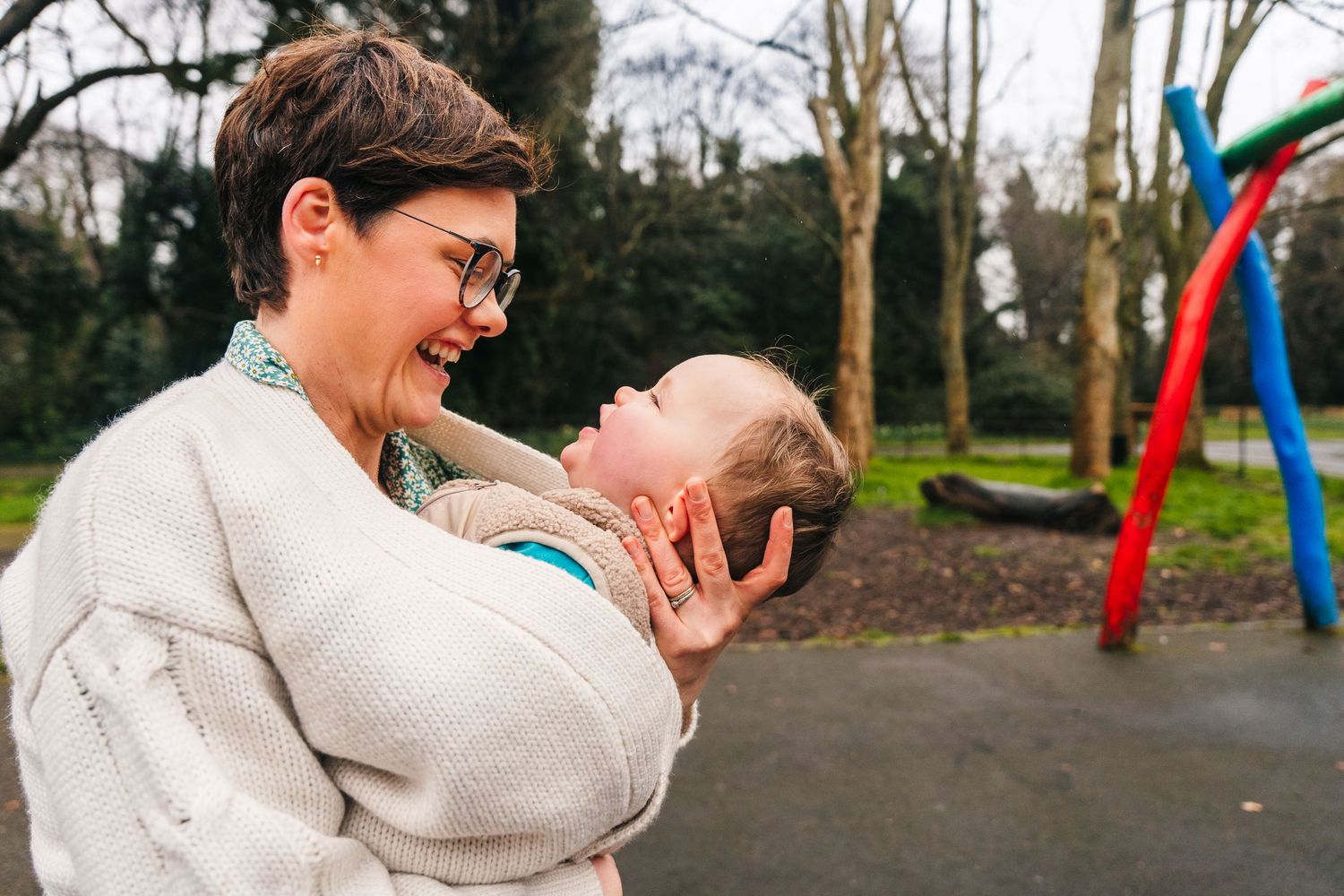 Family photographer Dublin IrelA sequence of playful moments captured at a park playground with swings and playground equipment in daylight.