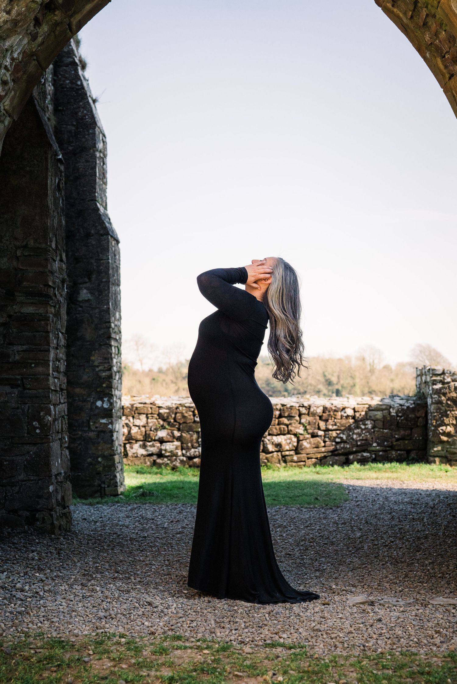 Artistic silhouette photos taken under a medieval stone archway in a castle ruin. Family PHOTOGRAPHER Dublin