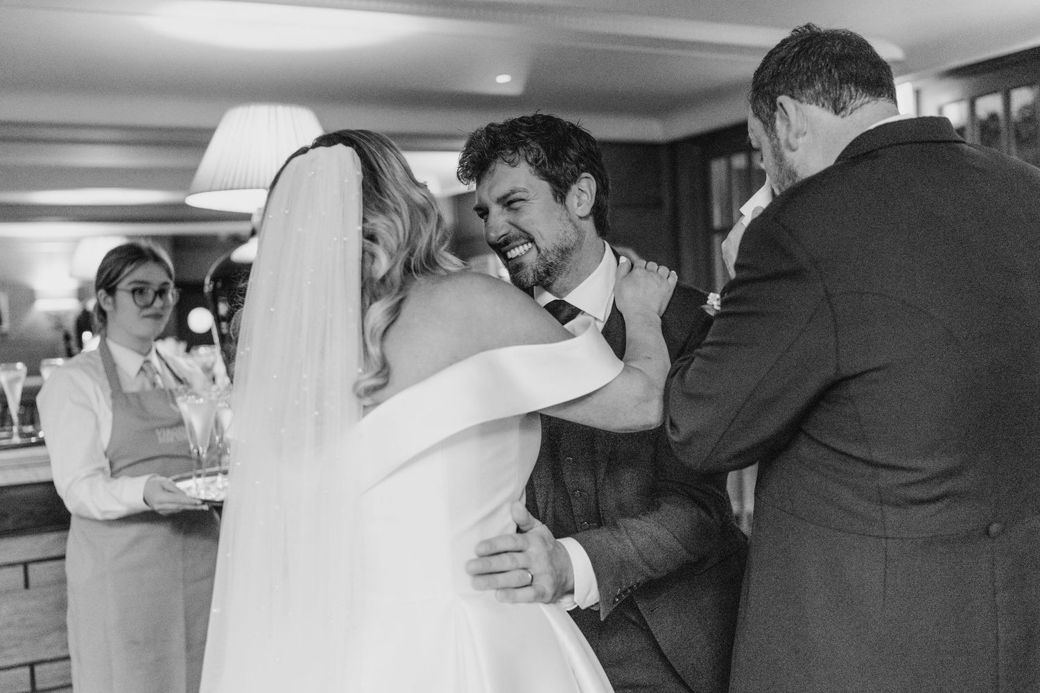 A tender black and white moment captured during wedding celebrations.  Virginia Park Lodge Wedding Photographer Cavan Dublin Ireland