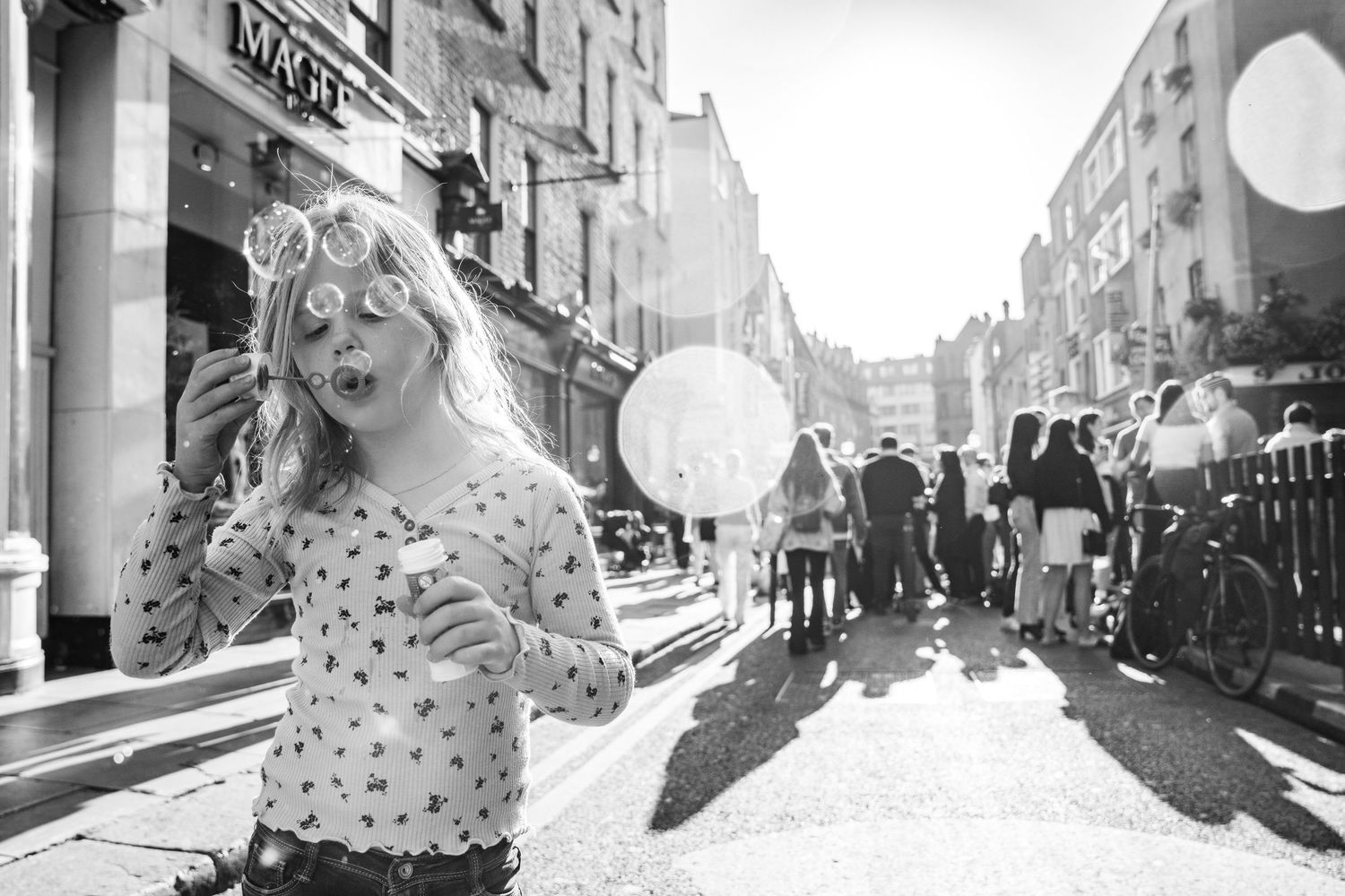 A series of vintage sepia street photographs showing urban life and local people in various city settings. family PHOTOGRAPHER Dublin