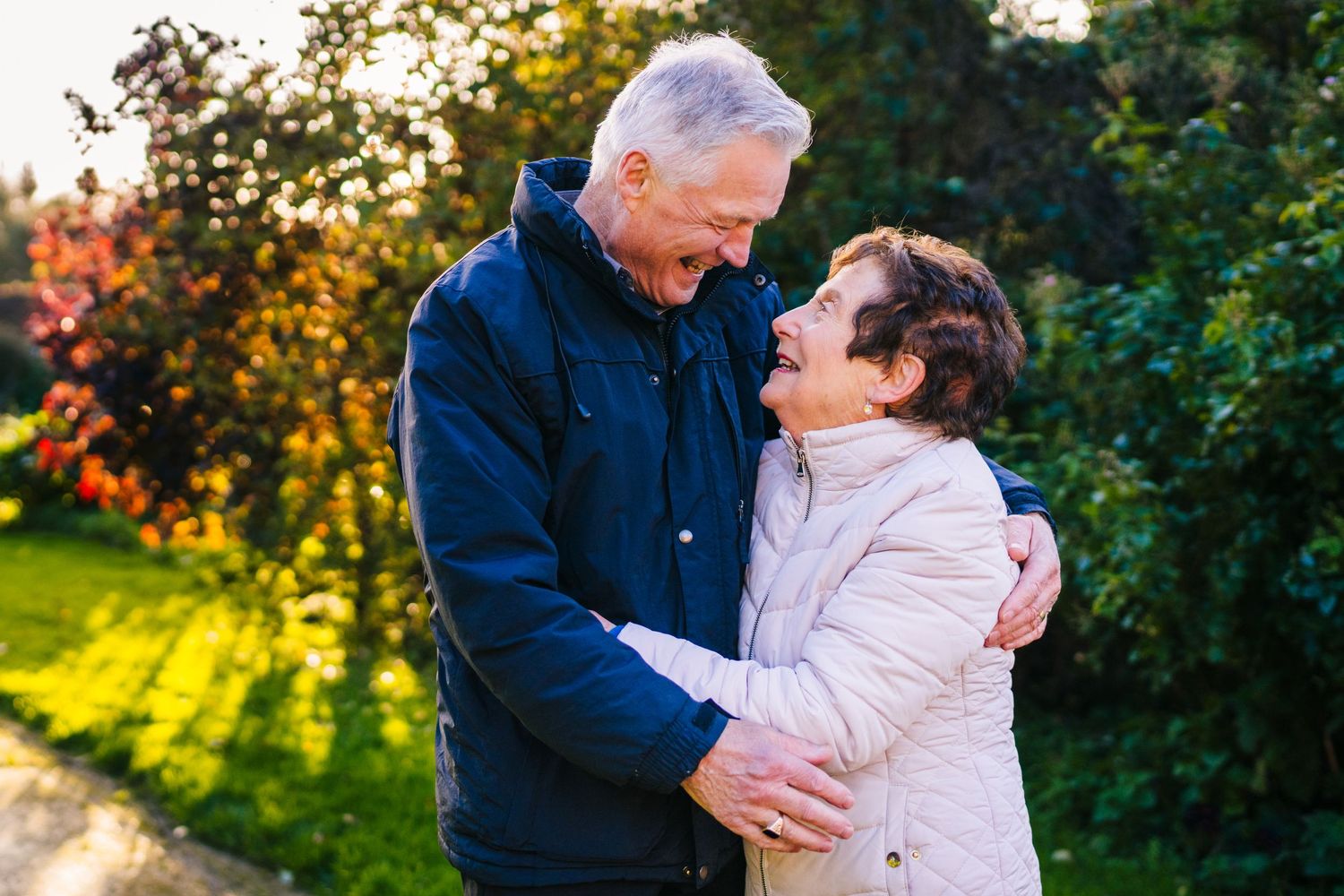 An affectionate mature couple share a tender moment outdoors on an autumn afternoon. PHOTOGRAPHER Dublin ireland