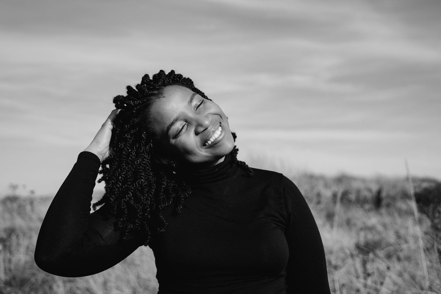 Artistic black and white portrait with natural lighting and dramatic pose. Dublin professional headshots photographer