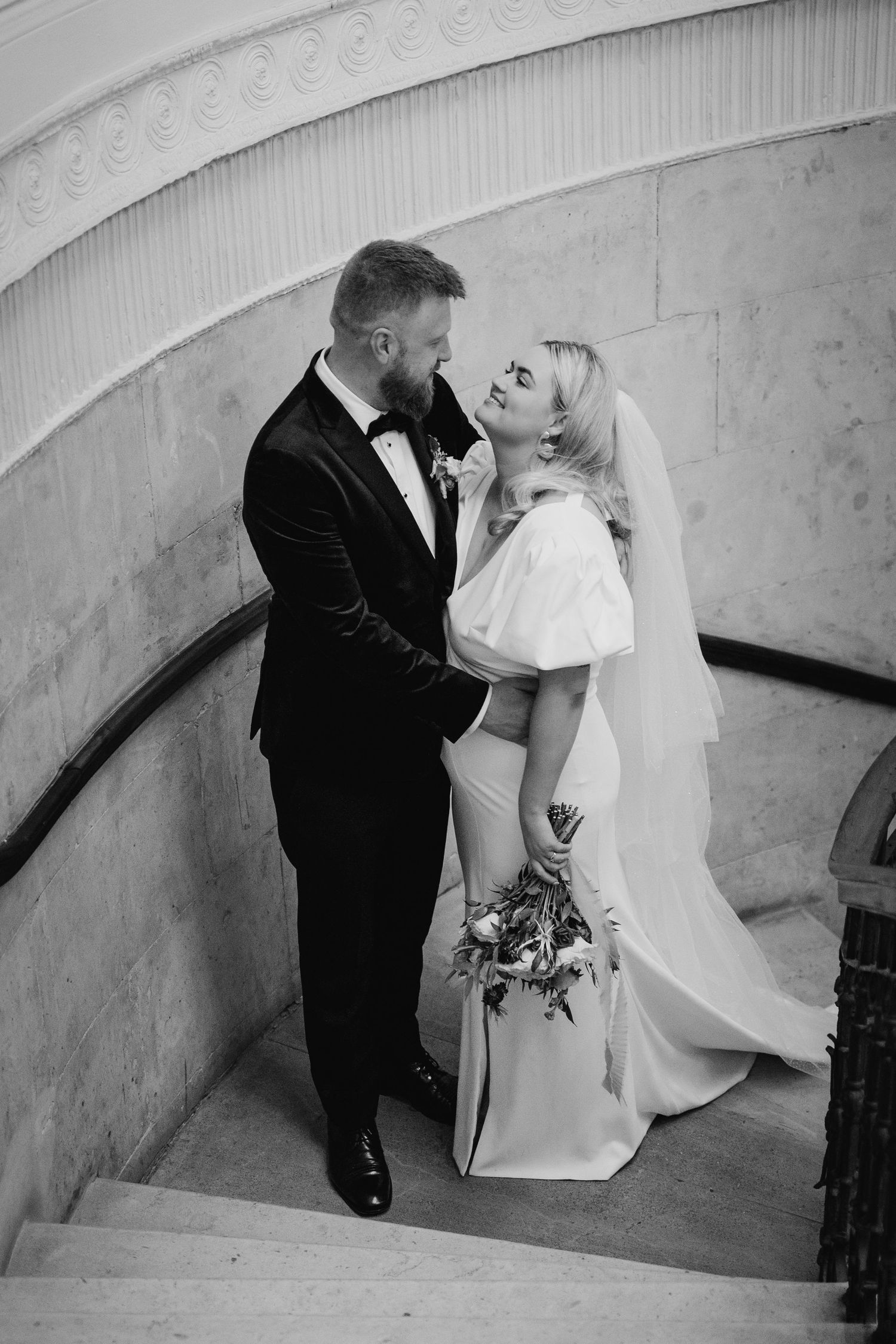 Artistic black and white wedding photo on curved staircase. Wedding photographer dublin
