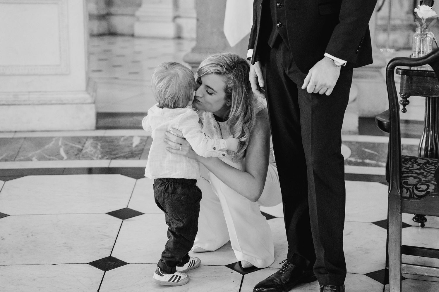 Intimate wedding moments captured in a grand white-columned indoor venue. City Hall Dublin wedding photogrAPher