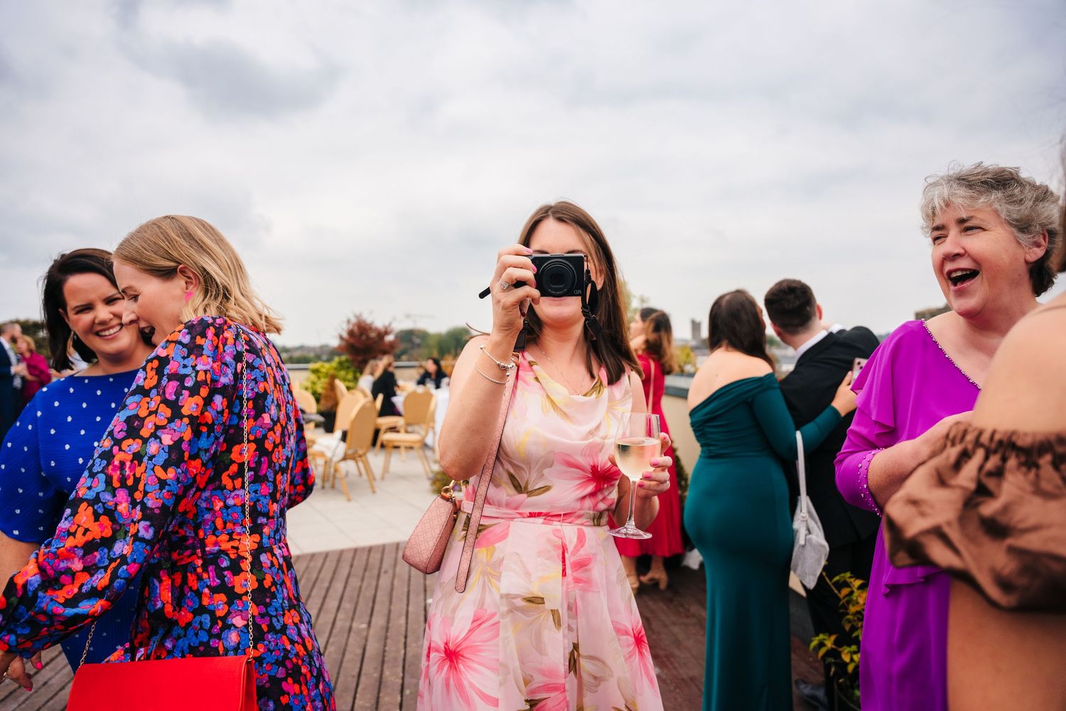 Wedding guests share laughter and joy during an outdoor reception celebration.Wedding Photography Trim Castle Ireland