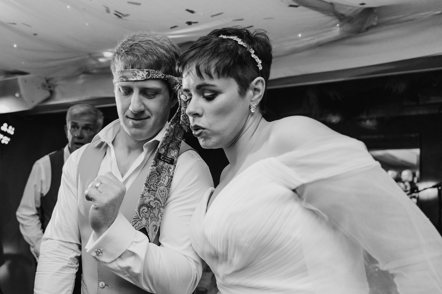 Millhouse slane wedding photographer dublin Two dancers in formal white attire perform at a party venue.