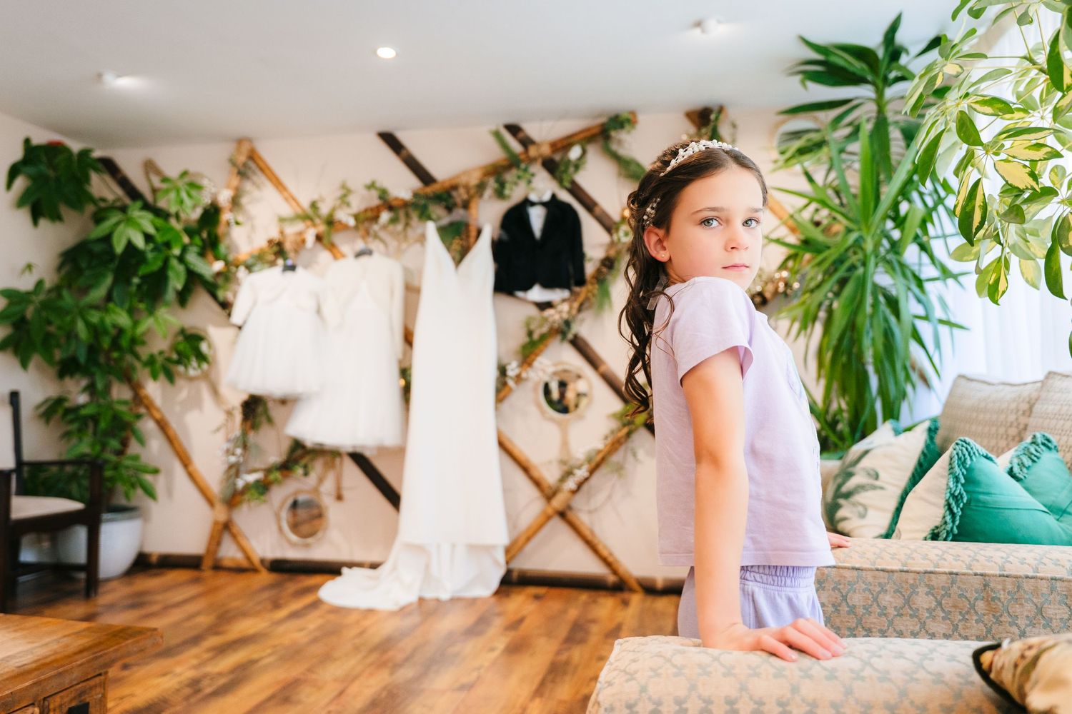 A series of decorative wooden wall hangings with plants and macrame displayed in a modern boho-Ballymagarvey Wedding photographer
