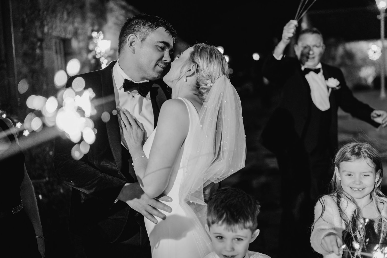 Black and white photos capturing joyful moments at an evening wedding reception. Ballymagarvey Wedding photographer