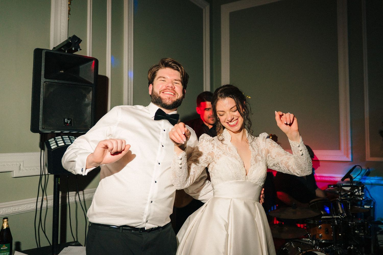 Energetic dance moves at a wedding reception with dark ambient lighting. Stephens green club dublin Wedding photographer