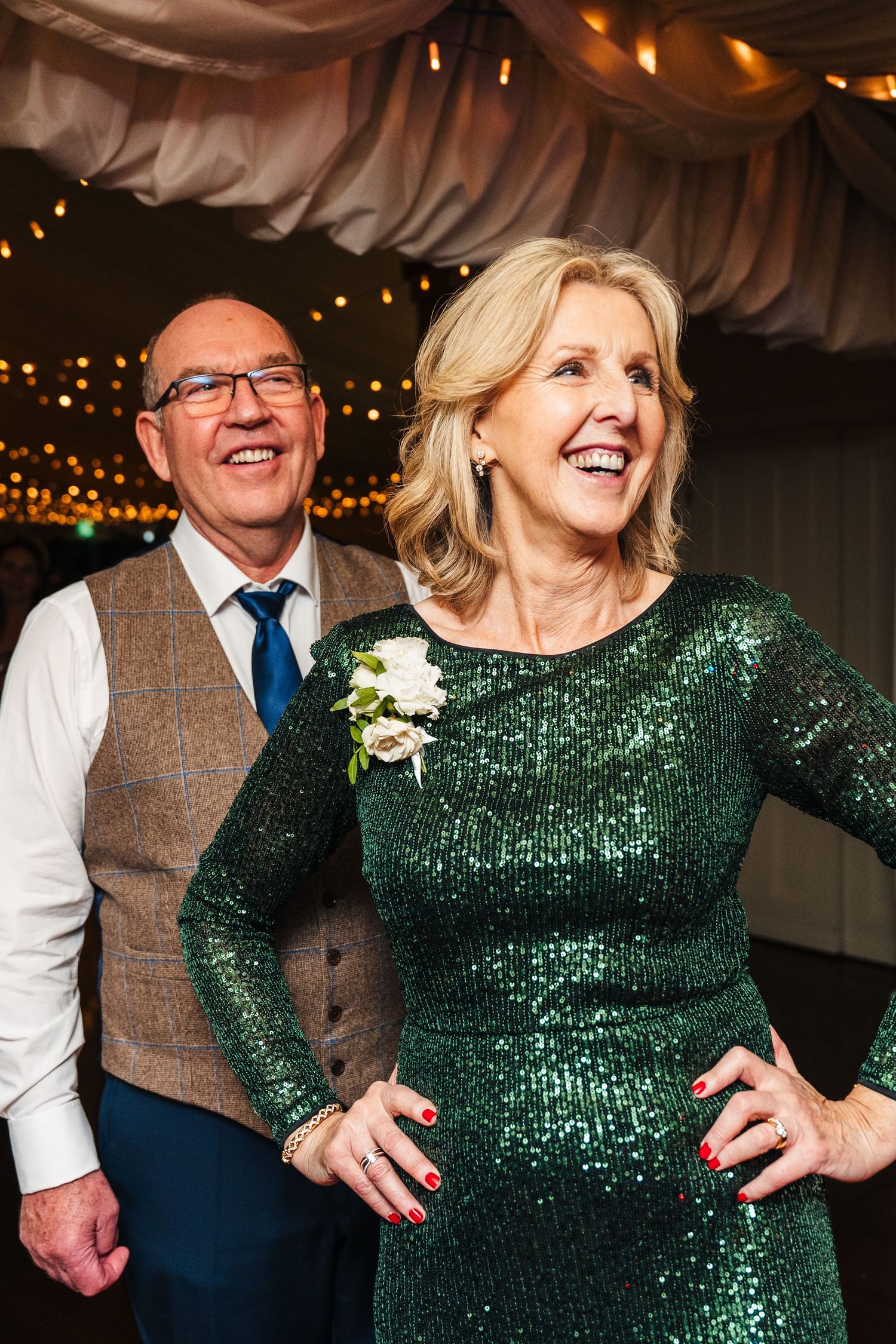 Wedding guest in sparkling emerald dress dancing and celebrating at reception.  Virginia Park Lodge Wedding Photographer Cavan Dublin Irelan