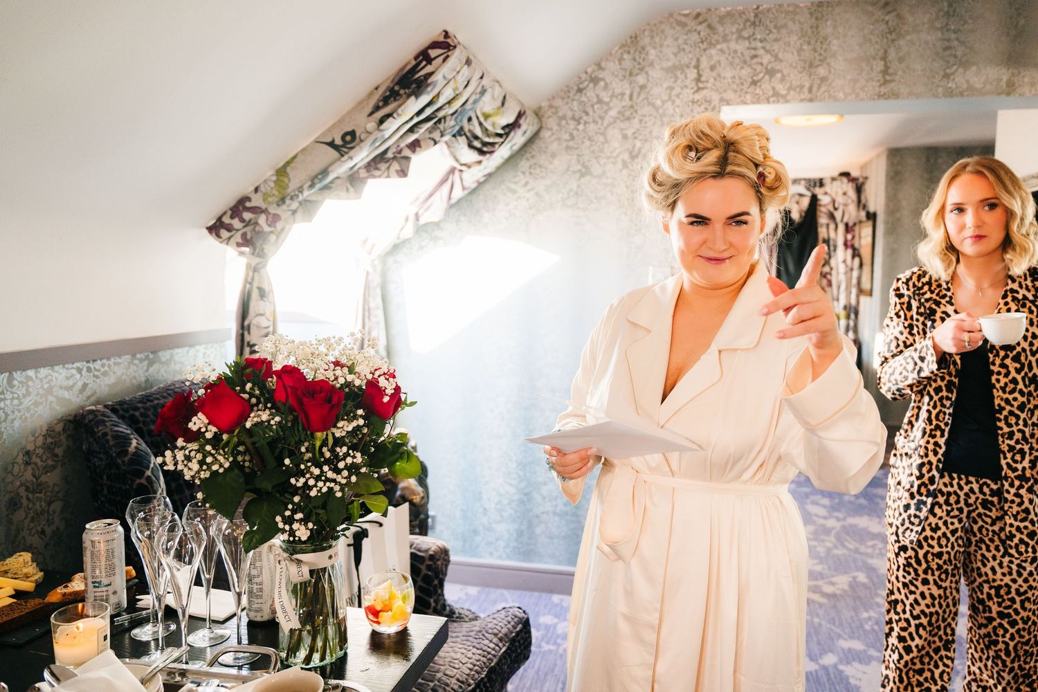 Wedding preparation scene with elegant decor and floral arrangements in a bright indoor setting. Wedding photographer dublin