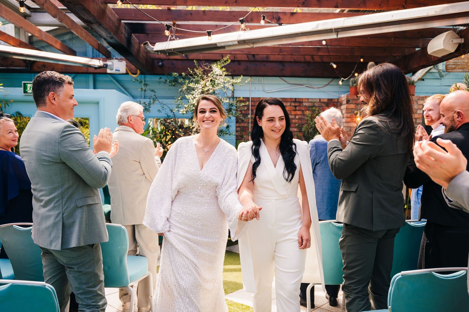 Group photo of wedding attendees dressed in white and gray formal wear. House Dublin Wedding Photographer
