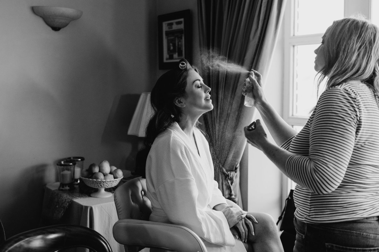Castle Leslie Wedding Photographer Dublin preparation scene with professional styling taking place in an intimate setting.