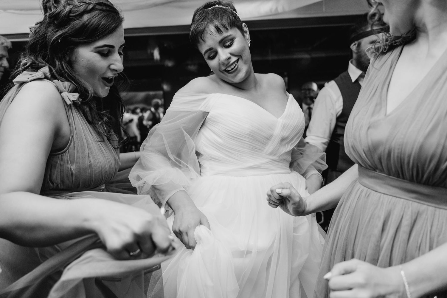 Millhouse slane wedding photographer dublin Wedding party dancing and celebrating in black and white photograph.