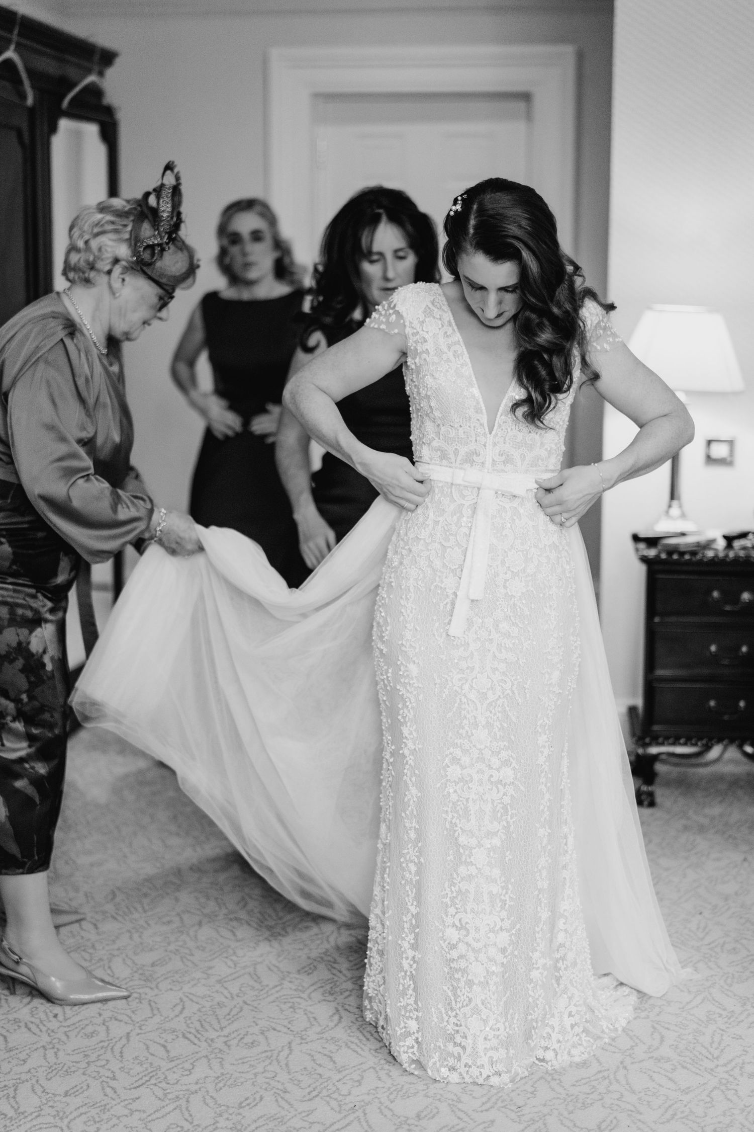 A sequence of photos showing a bride getting ready in her lace wedding dress against a light background.