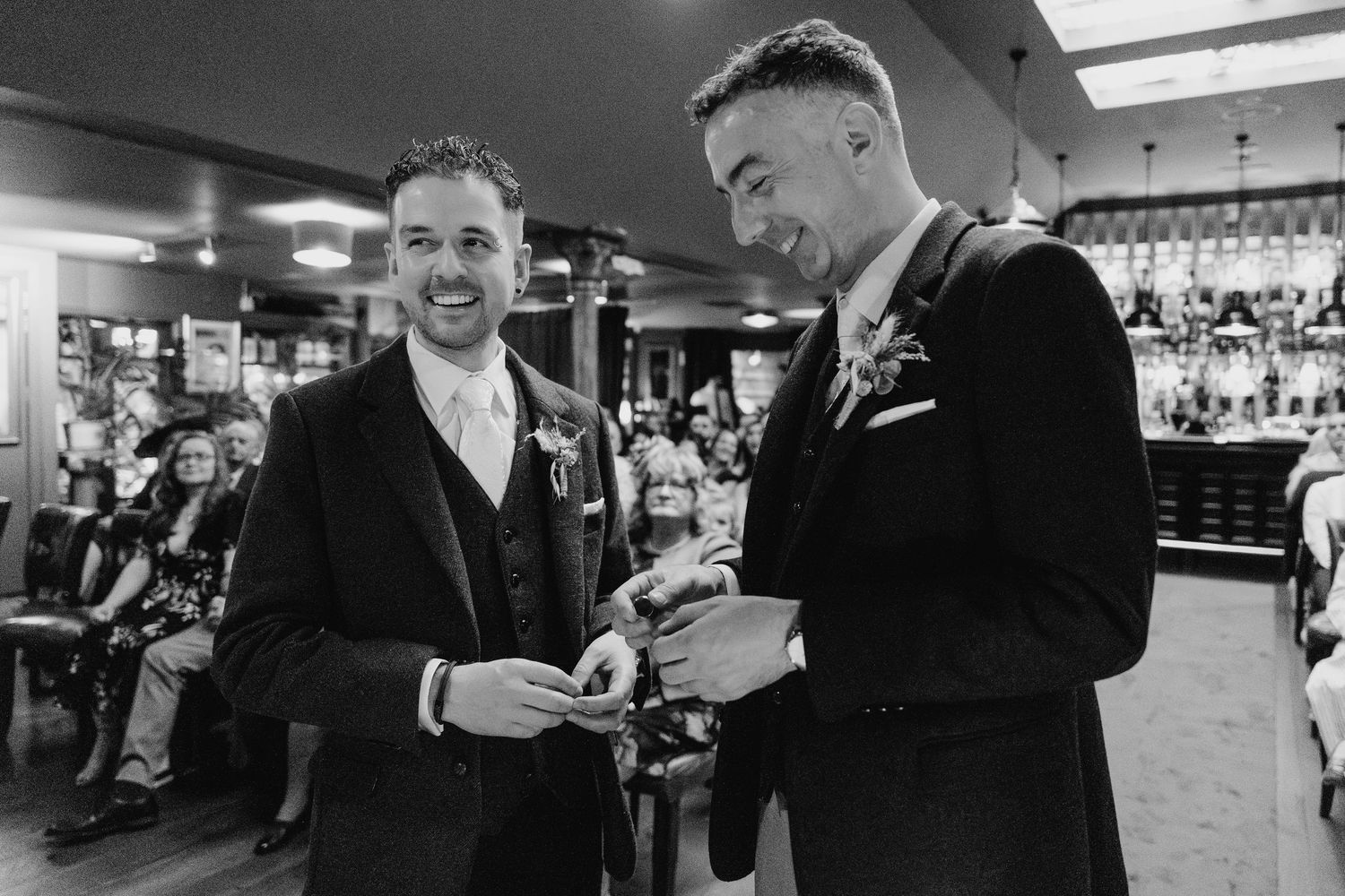Candid reception moments captured in black and white at an indoor venue. Marco Pierre Dublin Wedding Photographer