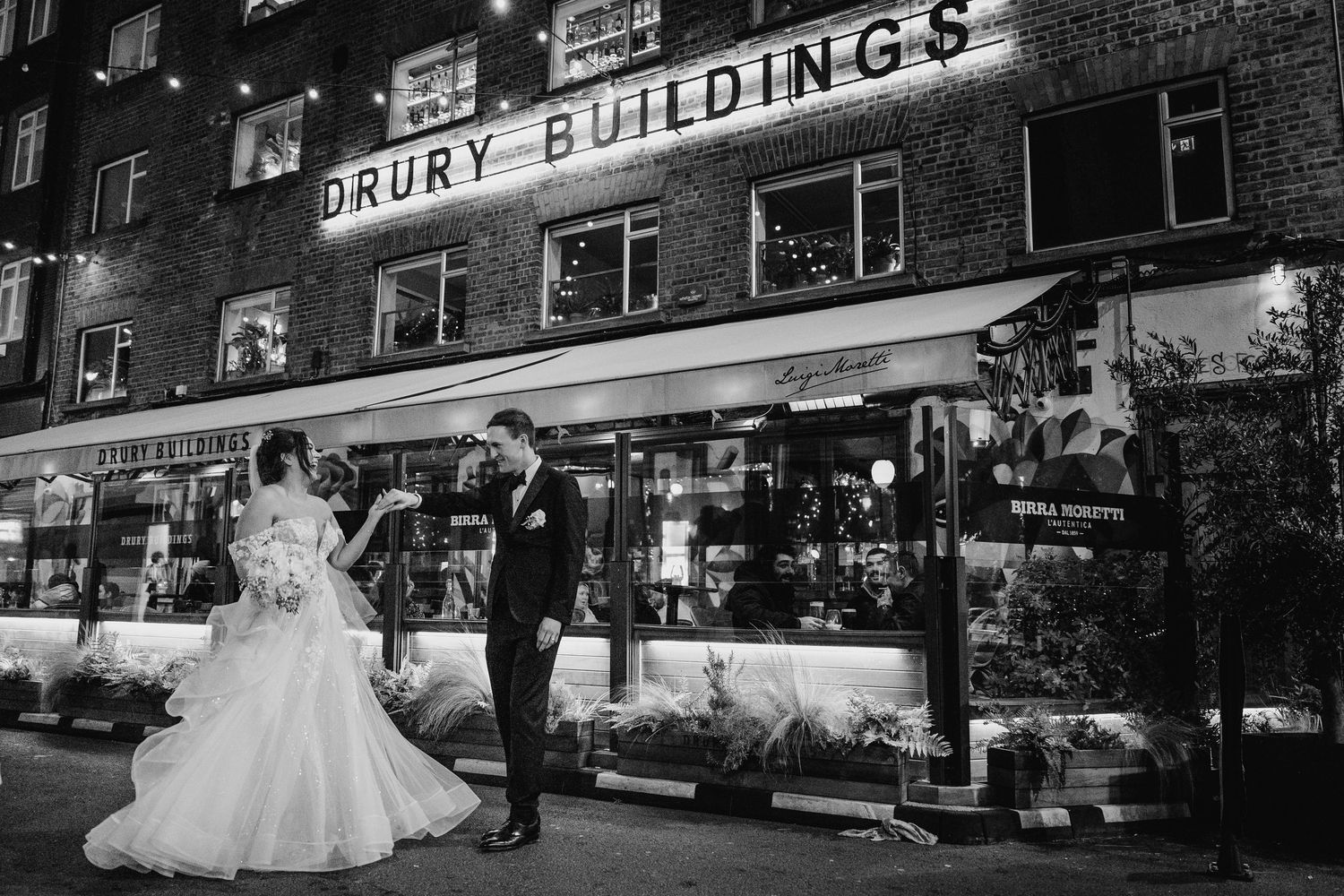 A black and white wedding photo of a couple outside the historic Drury Buildings. Wedding PHOTOGRAPHER Dublin